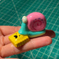 Snail with Ravioli Figurine